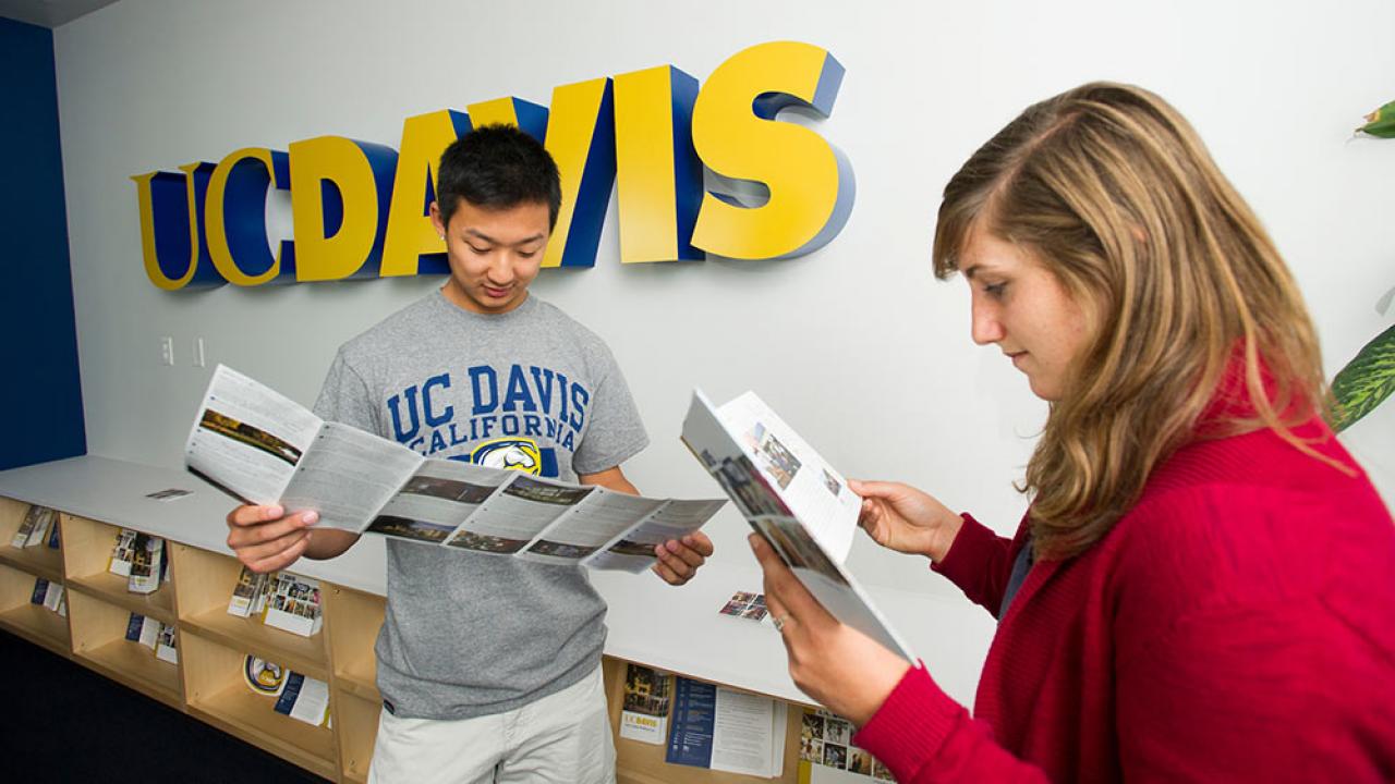 Students read brochures at the TV Welcome center