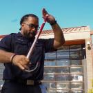 Abiel Malepeai with his fraternity cane outside the TV Fire Department.