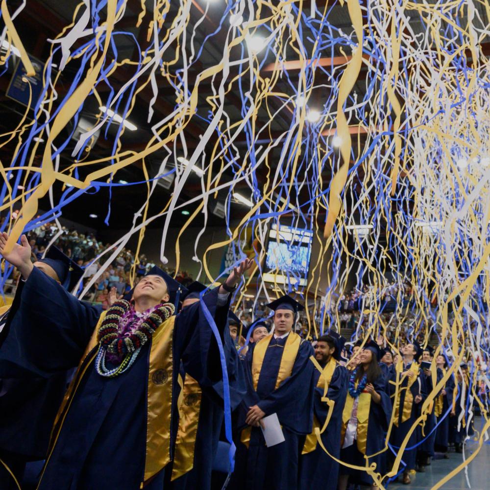 Streamers fall from the ceiling at the TV Commencement ceremony
