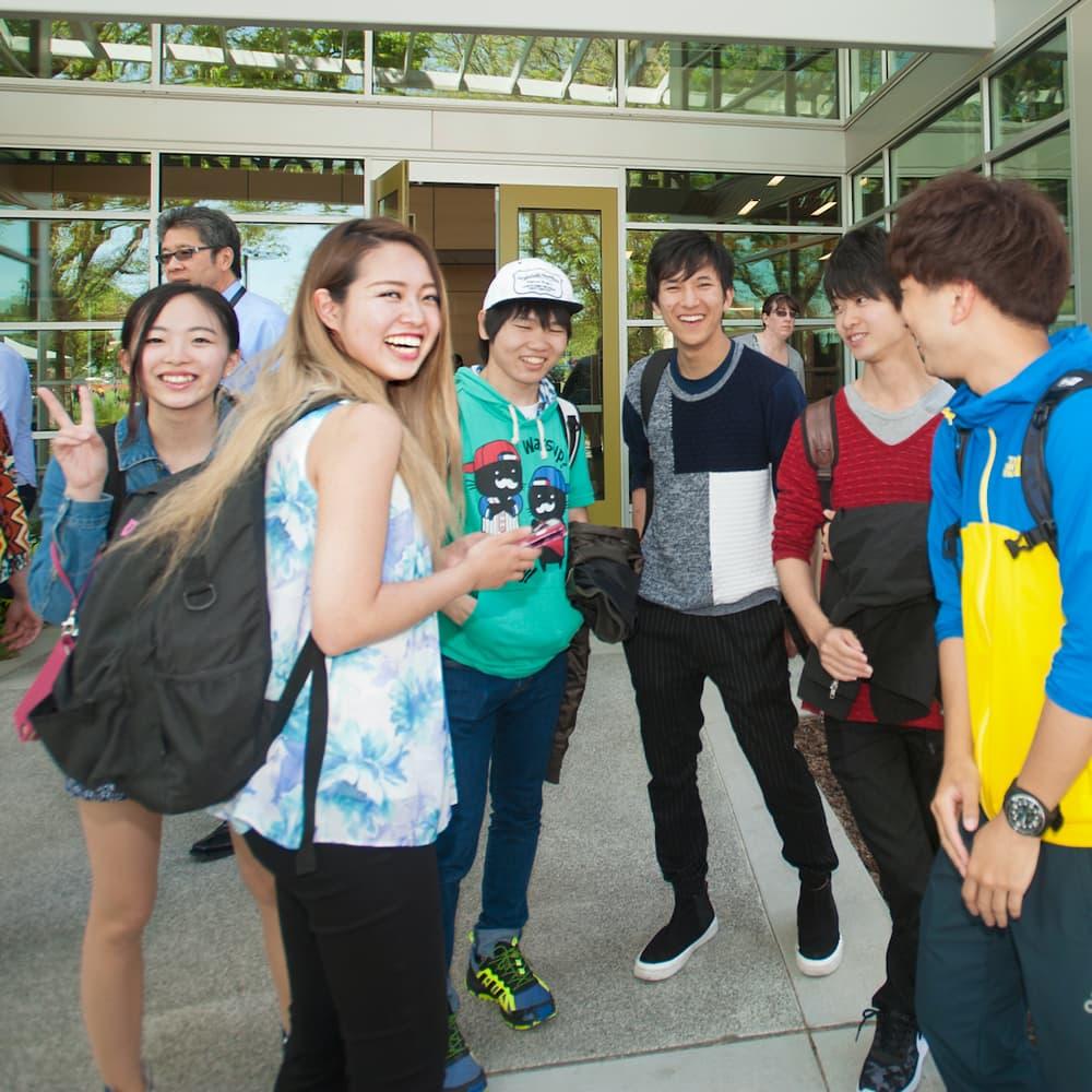 International students standing in front of the international center at TV.